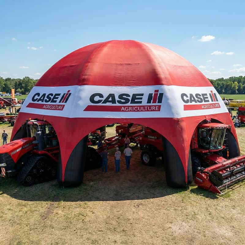 Tractors underneath giant inflatable dome tent